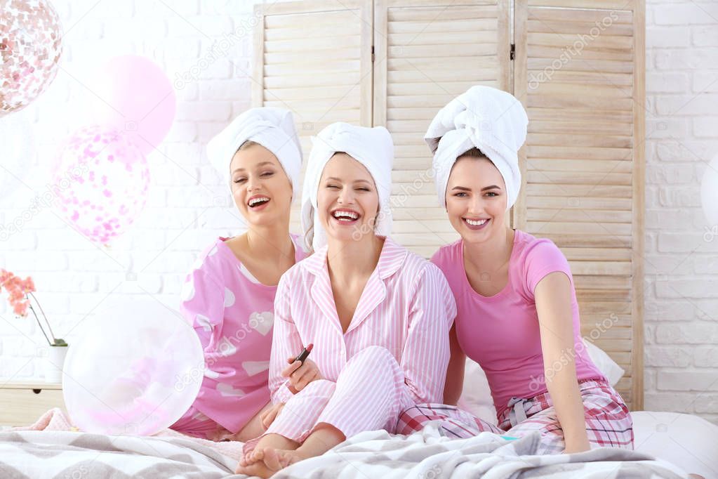 Beautiful young women in pajamas after shower at hen party