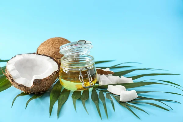 Composition with coconut oil on color background — Stock Photo, Image