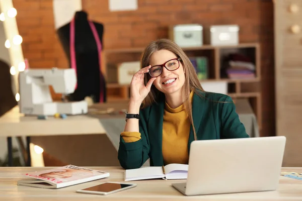 Portrait of beautiful female business owner in atelier — Stock Photo, Image