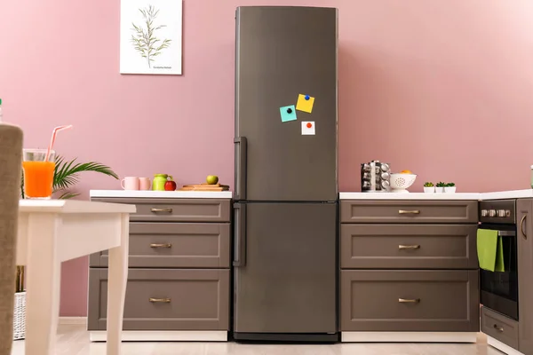 Big modern fridge in interior of kitchen — Stock Photo, Image