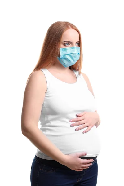 Young pregnant woman with protective mask on white background — Stock Photo, Image