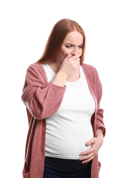 Молодая беременная женщина, страдающая токсикозом на белом фоне — стоковое фото