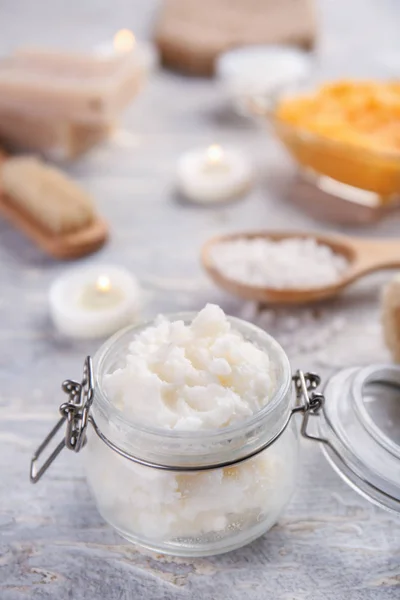 Jar with body scrub on table — Stock Photo, Image