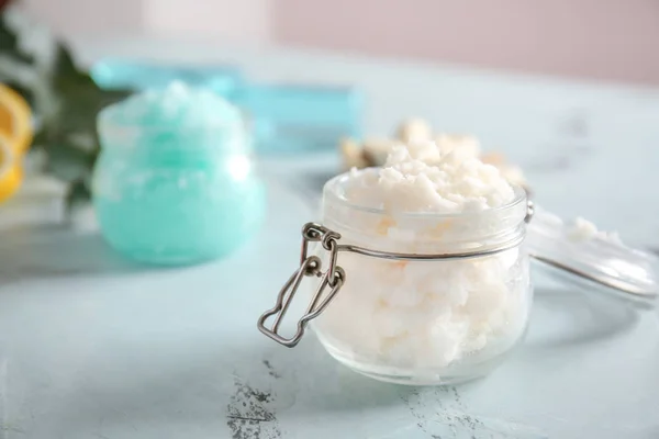 Jar with body scrub on table — Stock Photo, Image