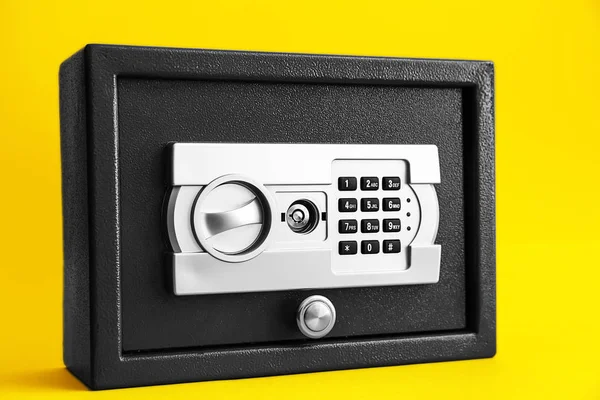 Modern safe on color background — Stock Photo, Image