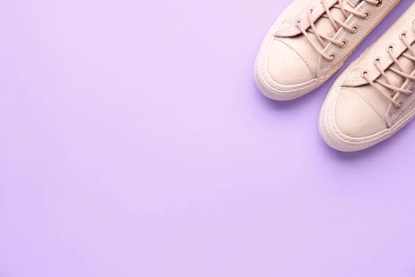 Pair of stylish casual shoes on color background — Stock Photo, Image