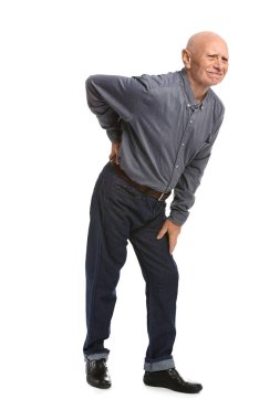 Senior man suffering from back pain on white background clipart