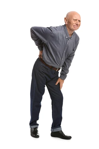 Senior man suffering from back pain on white background — Stock Photo, Image