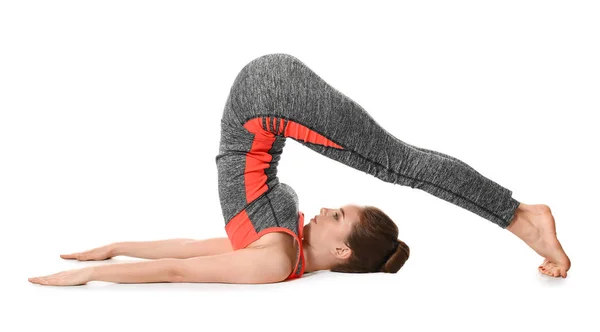 Sportovní žena cvičí jógu na bílém pozadí — Stock fotografie