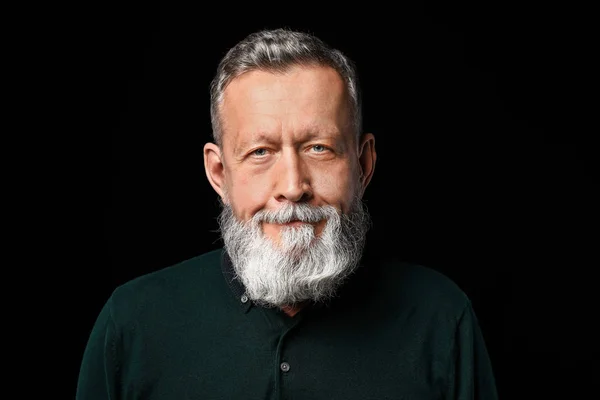 Portrait of handsome senior man on dark background