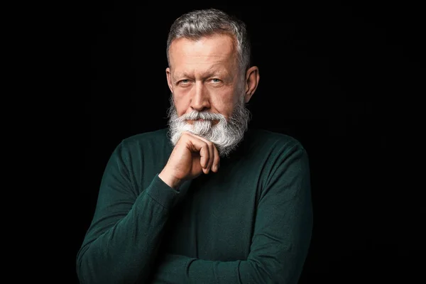 Portrait of handsome senior man on dark background — Stock Photo, Image