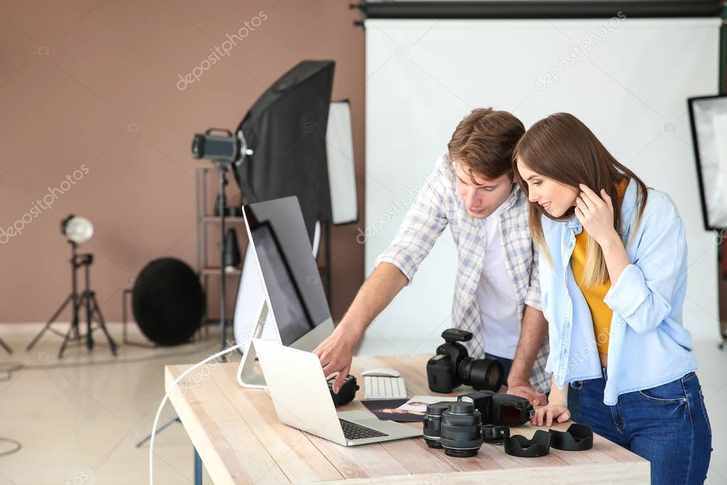 Professional photographers in modern studio