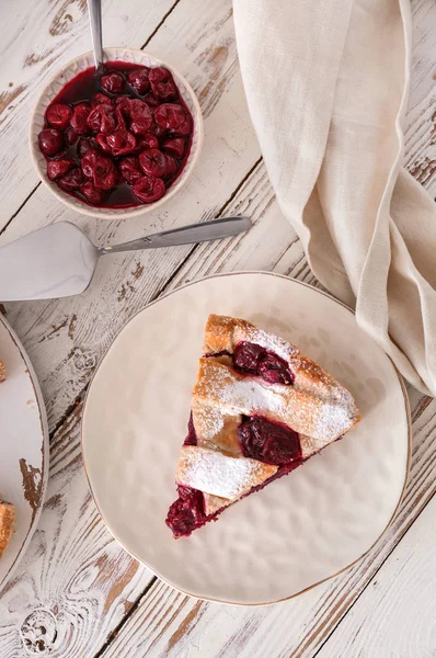 Tasty cherry pie on white wooden table — Stock Photo, Image