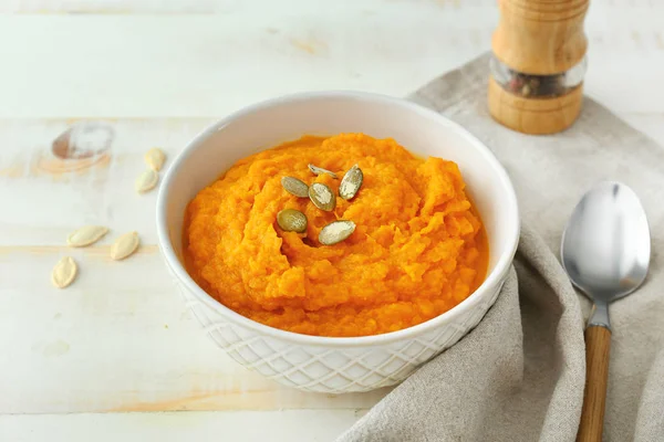 Bowl with mashed sweet potato on wooden table — Stock Photo, Image