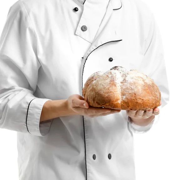 Young baker with fresh bread on white background, closeup — Stock Photo, Image