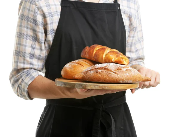 Jonge chef-kok met verse bakkerijproducten op witte achtergrond, close-up — Stockfoto