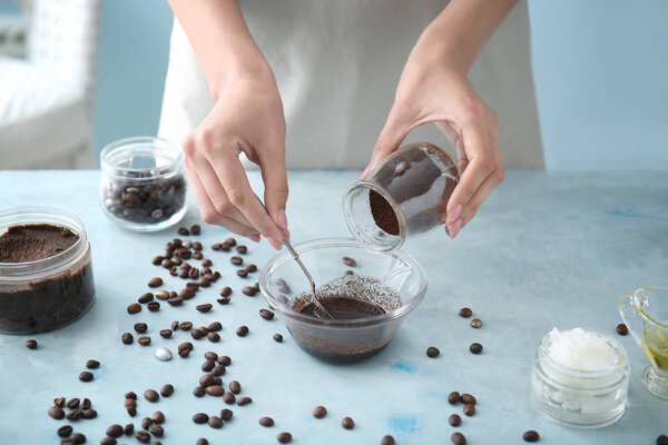 Woman preparing body scrub at table