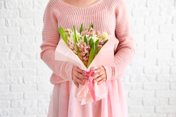 Woman with beautiful hyacinth flowers on white background — Stock Photo, Image