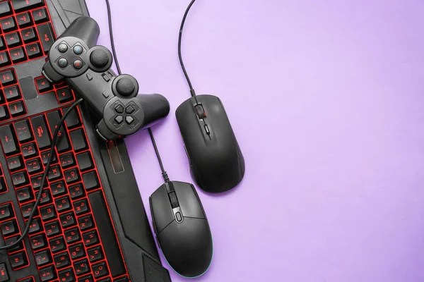 Modern gaming accessories on color background