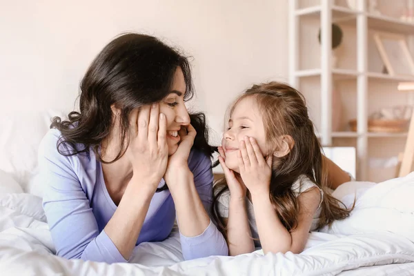 Happy mother with daughter resting at home — Stock Photo, Image