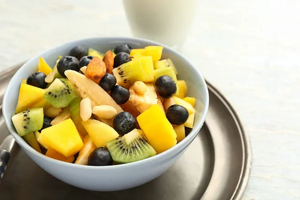 Bowl with tasty mango salad on table — Stock Photo, Image