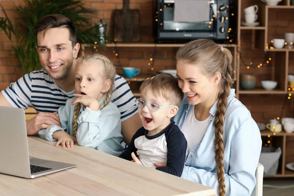 Emotional family watching cartoons at home — Stock Photo, Image