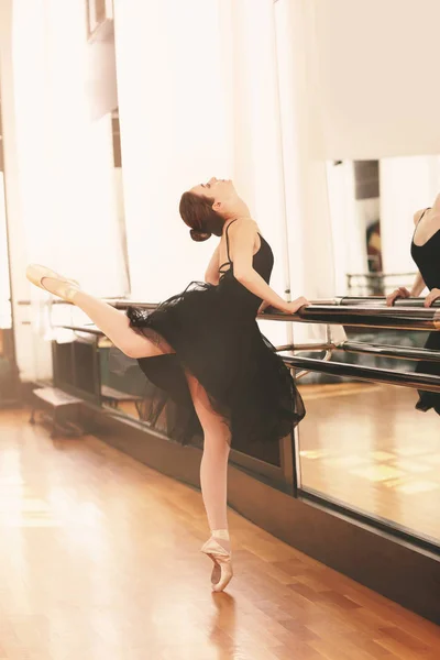 Beautiful young ballerina in dance studio — Stock Photo, Image