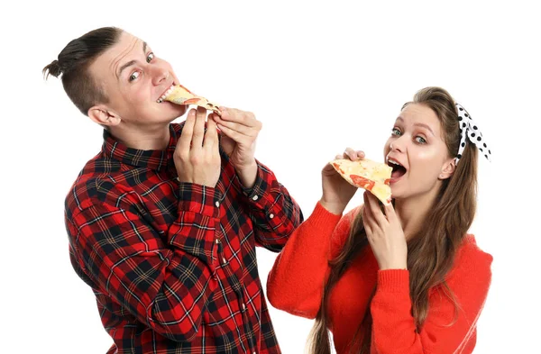 Young couple eating tasty pizza on white background — Stock Photo, Image