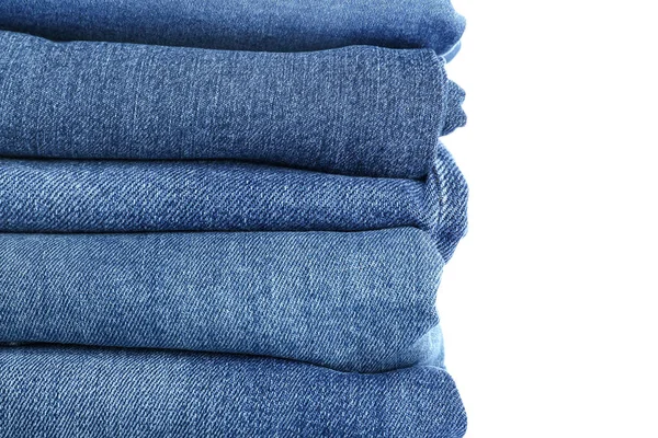 Stack of jeans pants on white background — Stock Photo, Image