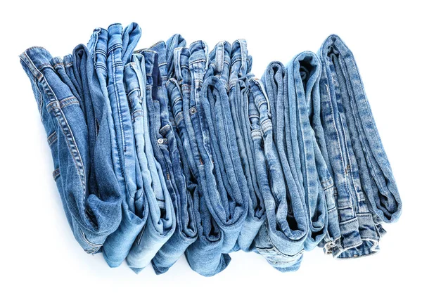 Olika jeans byxor på vit bakgrund — Stockfoto
