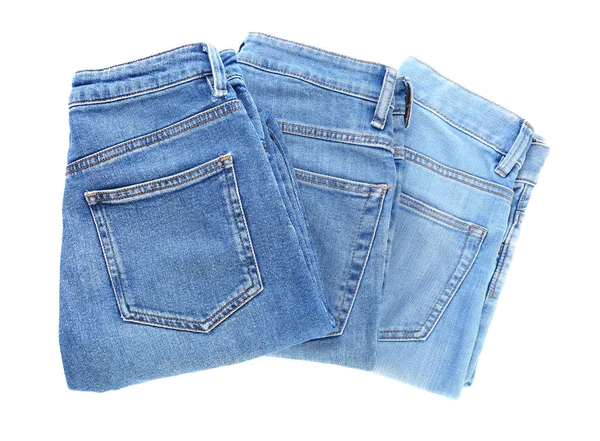 Verschillende jeans broeken op witte achtergrond — Stockfoto