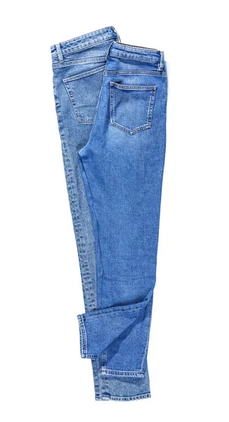 Olika jeans byxor på vit bakgrund — Stockfoto