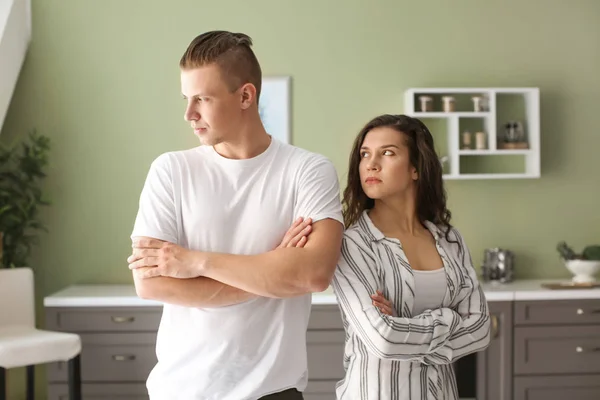 Young couple after quarrel in kitchen at home — Stock Photo, Image