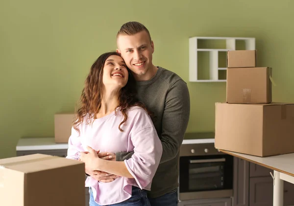 Adorable loving couple after moving into new house — Stock Photo, Image