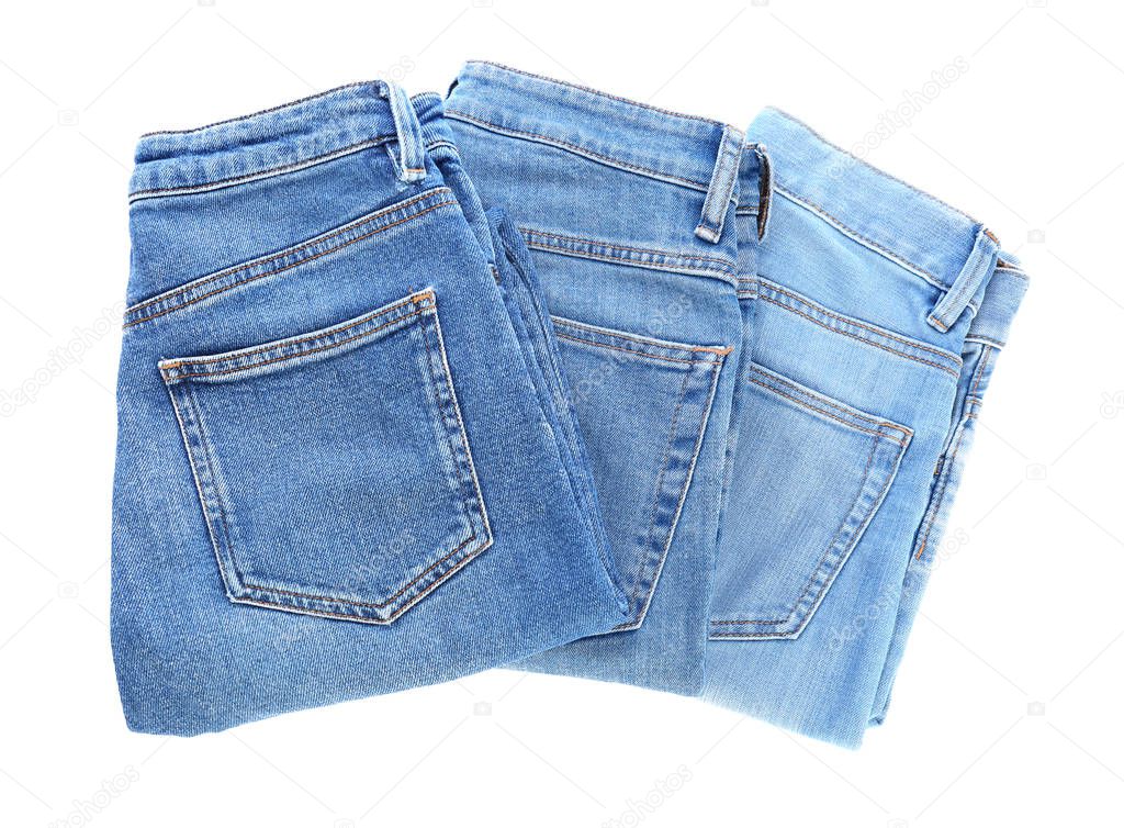 Different jeans pants on white background