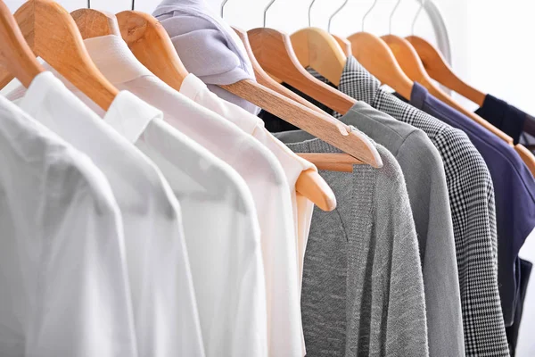 Hangers with female clothes, closeup — Stock Photo, Image