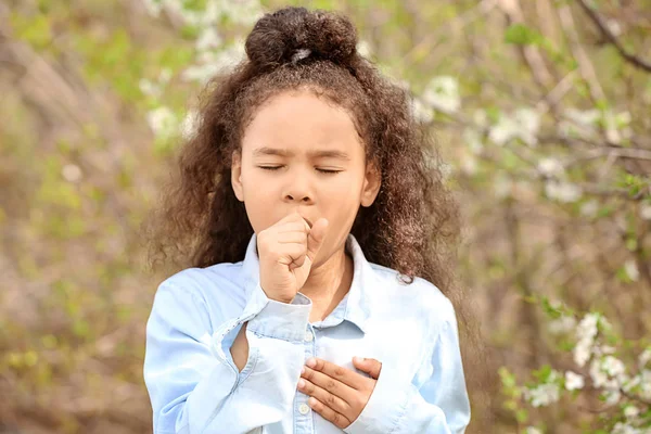 African-American girl having asthma attack outdoors on spring day — Stock Photo, Image