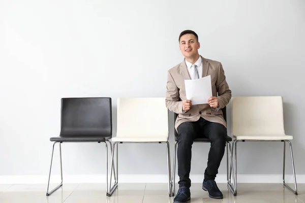 Young man waiting for job interview indoors — Stock Photo, Image