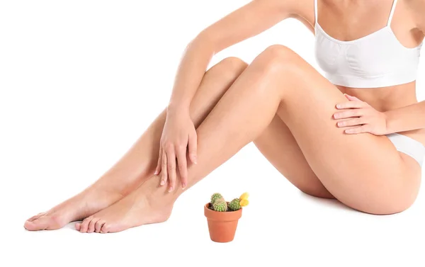 Beautiful young woman with cactus on white background. Depilation concept — Stock Photo, Image