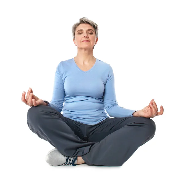Mature woman practicing yoga on white background — Stock Photo, Image