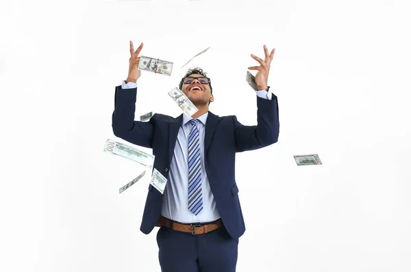 Happy businessman and falling dollar banknotes on white background — Stock Photo, Image