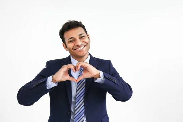 Handsome businessman making heart with his hands on white background — Stock Photo, Image