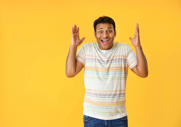 Excited man on color background — Stock Photo, Image