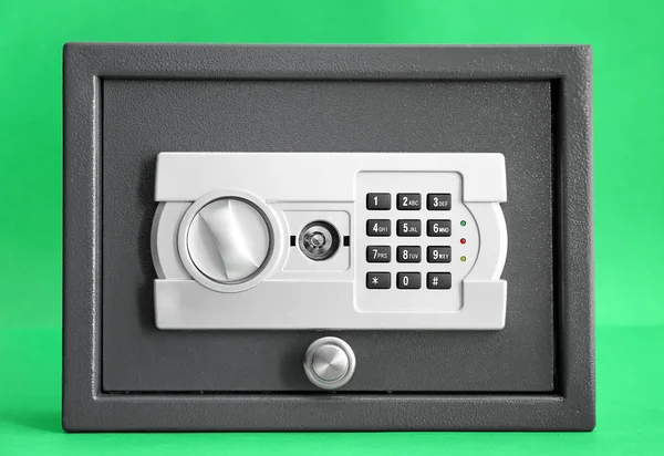 Modern safe on color background — Stock Photo, Image