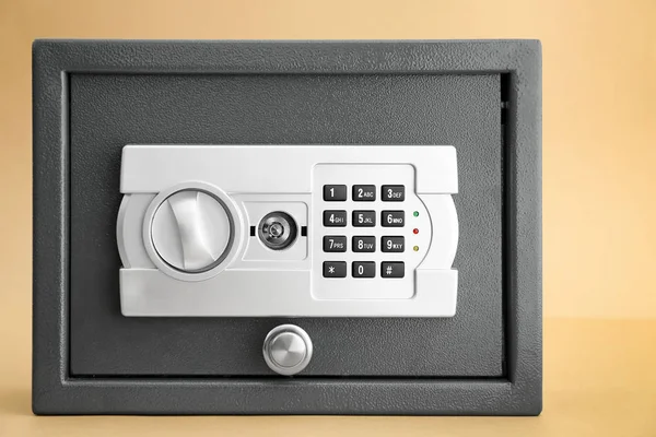 Modern safe on color background — Stock Photo, Image