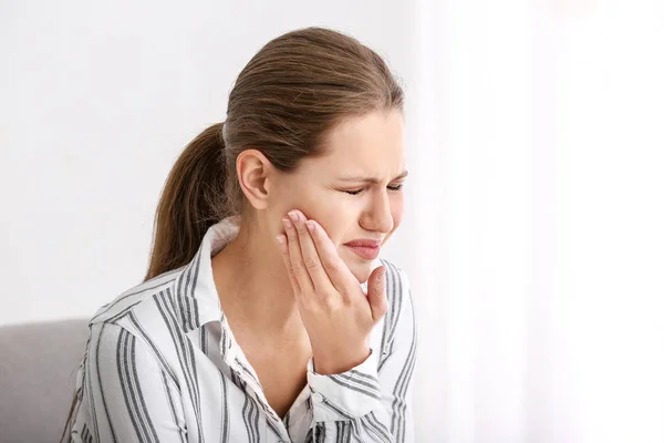 Young woman suffering from toothache at home — Stock Photo, Image