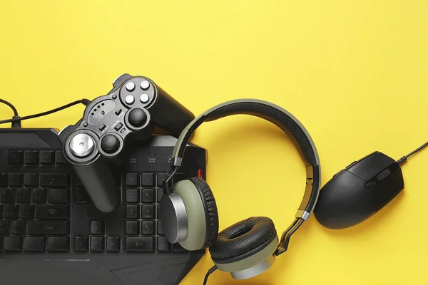 Modern gaming accessories on color background