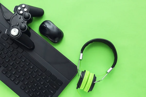 Modern gaming accessories on color background