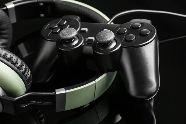 Modern gaming accessories on dark background, closeup