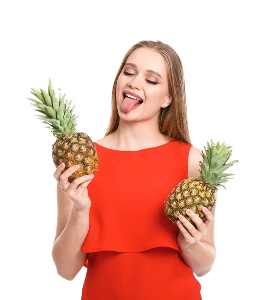 Beautiful young woman with pineapples on white background — Stock Photo, Image